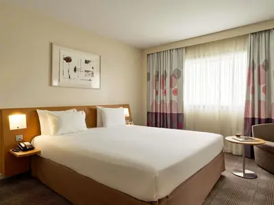 Un ou plusieurs lits dans un hébergement de l'établissement Novotel Paris La Defense Esplanade