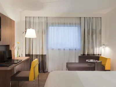 Un ou plusieurs lits dans un hébergement de l'établissement Novotel Paris La Defense Esplanade
