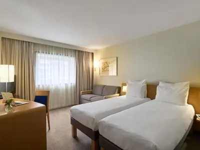 Un ou plusieurs lits dans un hébergement de l'établissement Novotel Paris La Defense Esplanade