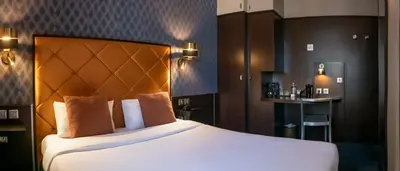 Un ou plusieurs lits dans un hébergement de l'établissement Hôtel du Parc Montparnasse
