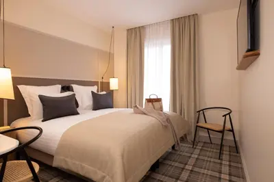 Un ou plusieurs lits dans un hébergement de l'établissement Hôtel Toujours & Spa