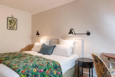 Un ou plusieurs lits dans un hébergement de l'établissement Hotel Touraine Opera