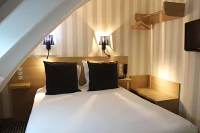Un ou plusieurs lits dans un hébergement de l'établissement Best Western Hotel Opéra Drouot