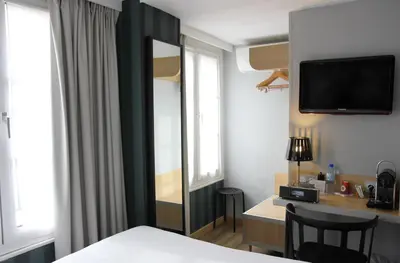 Un ou plusieurs lits dans un hébergement de l'établissement Best Western Hotel Opéra Drouot
