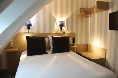 Un ou plusieurs lits dans un hébergement de l'établissement Best Western Hotel Opéra Drouot