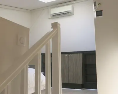 Un ou plusieurs lits dans un hébergement de l'établissement Mini Loft Daval