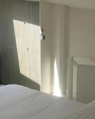 Un ou plusieurs lits dans un hébergement de l'établissement Mini Loft Daval