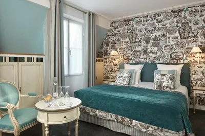 Un ou plusieurs lits dans un hébergement de l'établissement Hôtel Relais Saint Jacques Paris