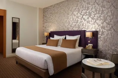 Un ou plusieurs lits dans un hébergement de l'établissement Timhotel Opéra Blanche Fontaine