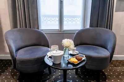 Coin salon dans l'établissement Hotel de la Paix Tour Eiffel