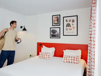 Un ou plusieurs lits dans un hébergement de l'établissement Aparthotel Adagio Access Paris Vanves - Porte de Versailles