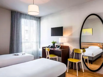 Un ou plusieurs lits dans un hébergement de l'établissement Aparthotel Adagio Access Paris Vanves - Porte de Châtillon