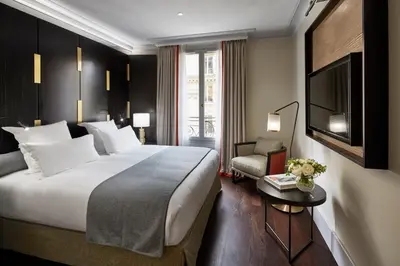 Un ou plusieurs lits dans un hébergement de l'établissement Hotel Montalembert