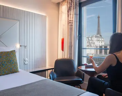 Un ou plusieurs lits dans un hébergement de l'établissement Le Parisis - Paris Tour Eiffel