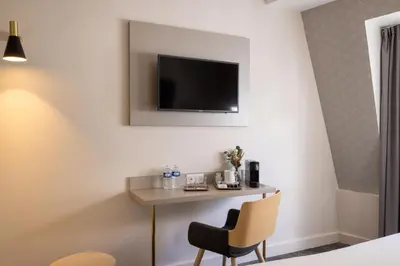 Télévision ou salle de divertissement dans l'établissement Villa des Ambassadeurs