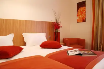 Un ou plusieurs lits dans un hébergement de l'établissement Westside Arc de Triomphe Hotel