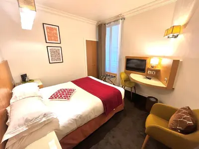 Un ou plusieurs lits dans un hébergement de l'établissement Westside Arc de Triomphe Hotel