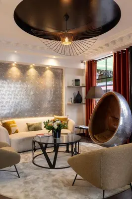 Coin salon dans l'établissement Hotel Elysées Bassano