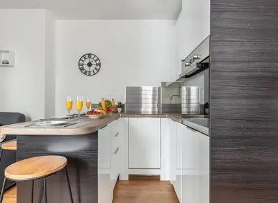 Cuisine ou kitchenette dans l'établissement Maison le Bac Apartments