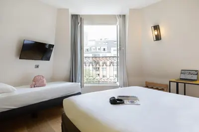 Un ou plusieurs lits dans un hébergement de l'établissement ibis Styles Paris Nation Porte De Montreuil