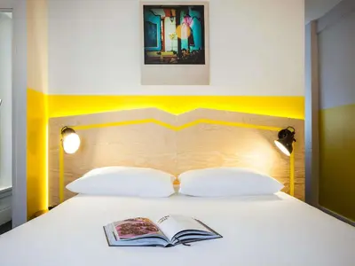Un ou plusieurs lits dans un hébergement de l'établissement ibis Styles Paris Nation Porte De Montreuil