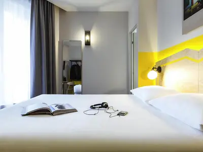 Un ou plusieurs lits dans un hébergement de l'établissement ibis Styles Paris Nation Porte De Montreuil