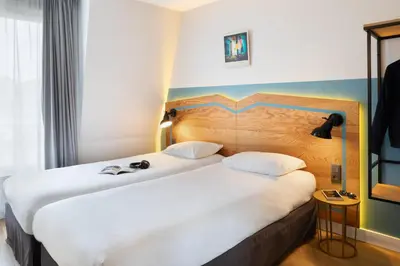 Un ou plusieurs lits dans un hébergement de l'établissement ibis Styles Paris Nation Porte De Montreuil