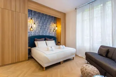 Un ou plusieurs lits dans un hébergement de l'établissement Cosy & Luxury Kléber Trocadéro Arc de Triomphe