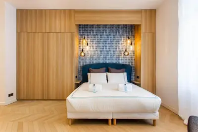 Un ou plusieurs lits dans un hébergement de l'établissement Cosy & Luxury Kléber Trocadéro Arc de Triomphe