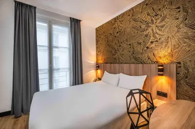 Un ou plusieurs lits dans un hébergement de l'établissement Hotel Daval