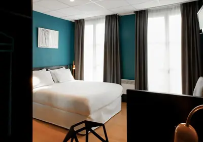Un ou plusieurs lits dans un hébergement de l'établissement Hotel Daval