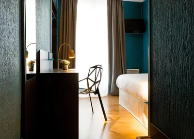 Un ou plusieurs lits dans un hébergement de l'établissement Hotel Daval