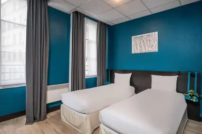 Un ou plusieurs lits dans un hébergement de l'établissement Hotel Daval