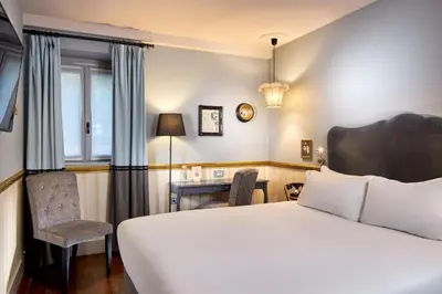 Un ou plusieurs lits dans un hébergement de l'établissement Les Plumes Hotel