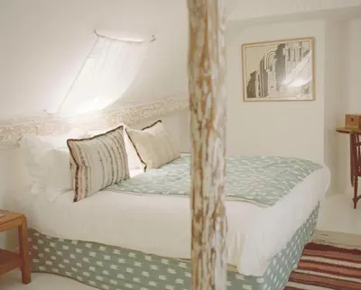 Un ou plusieurs lits dans un hébergement de l'établissement Hôtel du Temps Paris