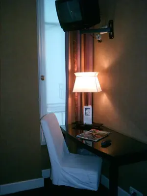 Un ou plusieurs lits dans un hébergement de l'établissement Hotel De La Jatte