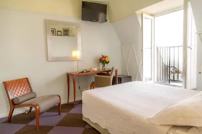 Un ou plusieurs lits dans un hébergement de l'établissement Hôtel Quartier Latin