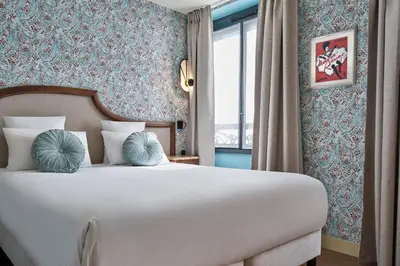 Un ou plusieurs lits dans un hébergement de l'établissement Hôtel Joséphine by Happyculture
