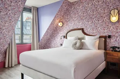 Un ou plusieurs lits dans un hébergement de l'établissement Hôtel Joséphine by Happyculture