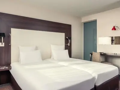 Un ou plusieurs lits dans un hébergement de l'établissement Mercure Paris Porte d'Orleans