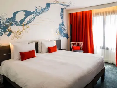 Un ou plusieurs lits dans un hébergement de l'établissement Novotel Paris Les Halles
