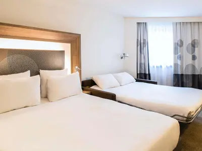 Un ou plusieurs lits dans un hébergement de l'établissement Novotel Paris Les Halles