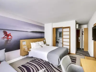 Un ou plusieurs lits dans un hébergement de l'établissement Novotel Paris Centre Gare Montparnasse