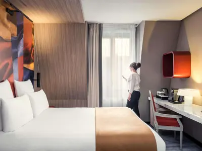 Un ou plusieurs lits dans un hébergement de l'établissement Mercure Paris Alesia