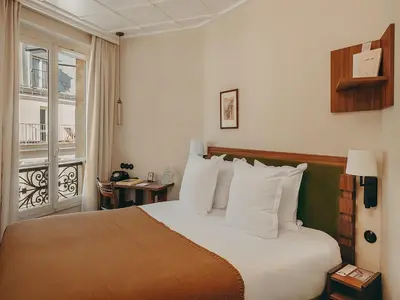 Un ou plusieurs lits dans un hébergement de l'établissement Hôtel du Savoir