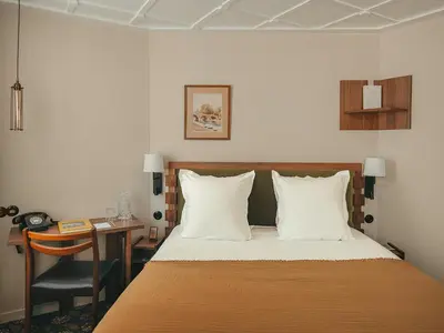 Un ou plusieurs lits dans un hébergement de l'établissement Hôtel du Savoir