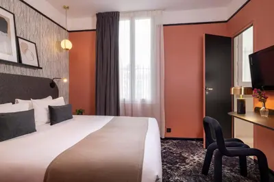 Un ou plusieurs lits dans un hébergement de l'établissement Hôtel Palais De Chaillot