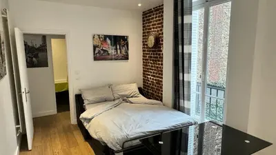 Un ou plusieurs lits dans un hébergement de l'établissement Gorgeous Paris Eiffel Tower
