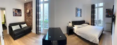 Un ou plusieurs lits dans un hébergement de l'établissement Gorgeous Paris Eiffel Tower