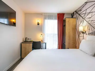 Un ou plusieurs lits dans un hébergement de l'établissement Mercure Paris Malakoff Parc des Expositions